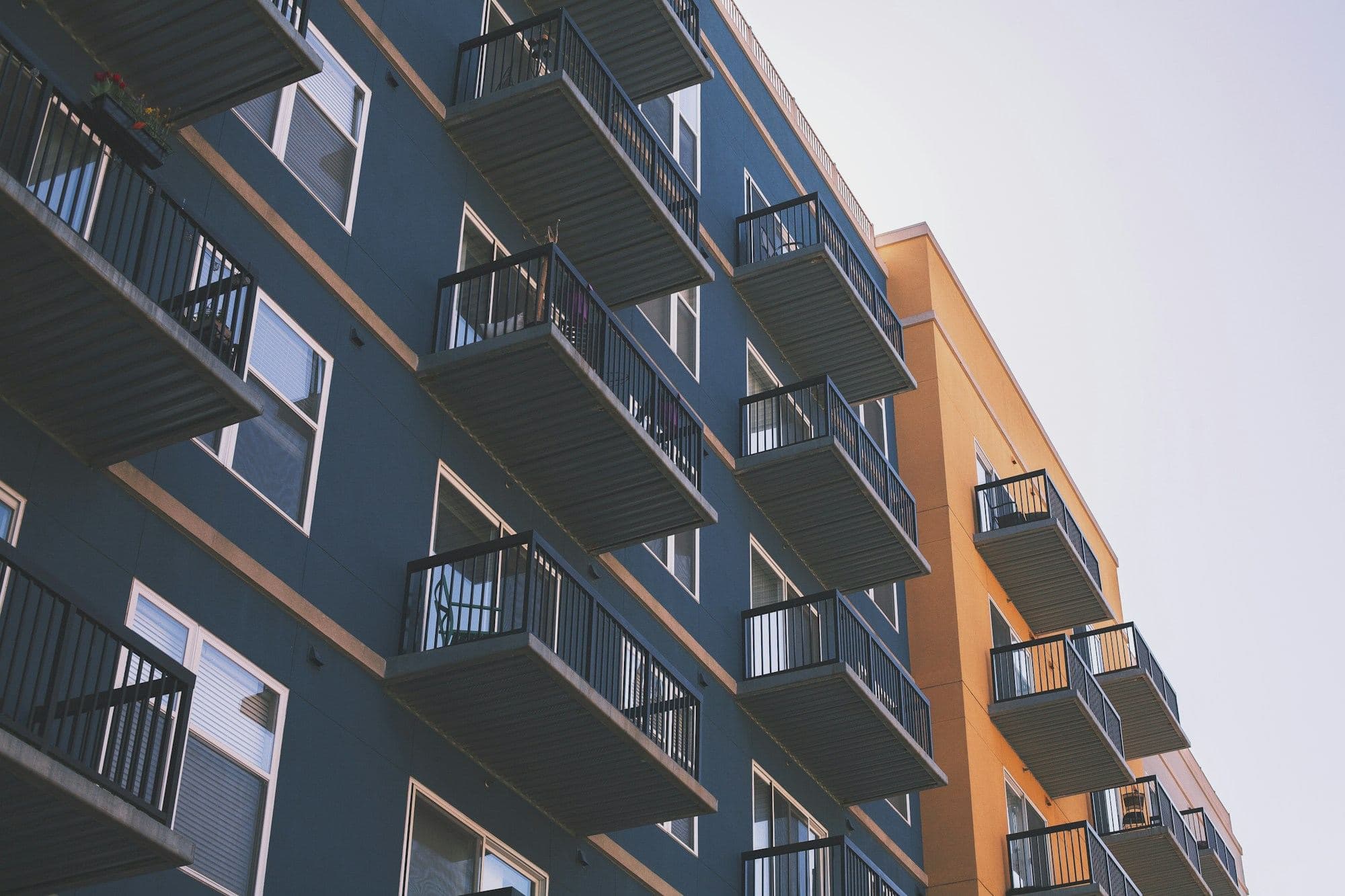 Multifamily apartment building with rows of balconies